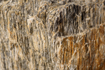 Texture of natural stone close up. Rough granite surface.