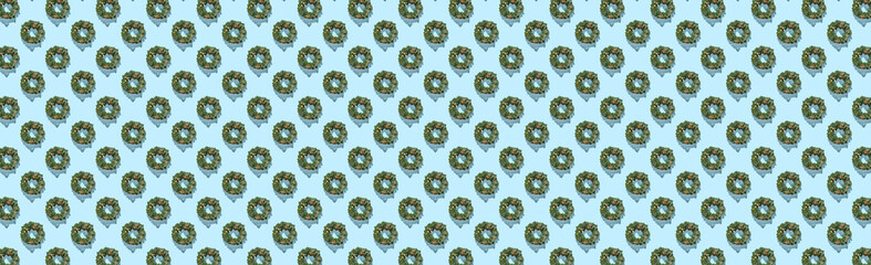 Pattern of advent wreath on green pastel background