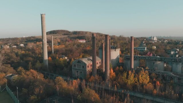Abandoned old production plant, cement plant in Bedzin, Grodzisk, Poland. Concept of abandoned places, industrial ruins, urbex. View from the drone, air.
