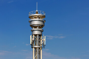 Fototapeta na wymiar Cell tower against the blue sky