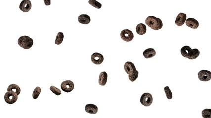 Chocolate rings cereal spill out into a bowl. Breakfast.