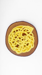 Kerupuk Mie Kuning or Yellow Noodles Crackers from Indonesia. Isolated on White