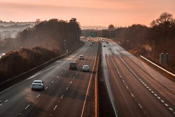 A sunset view on a motorway In Ireland Cork - obrazy, fototapety, plakaty