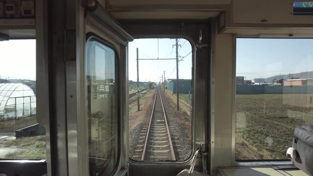 Fukui,Japan - December 8, 2022: Long straight single track of a railway operating in Fukui, Japan
