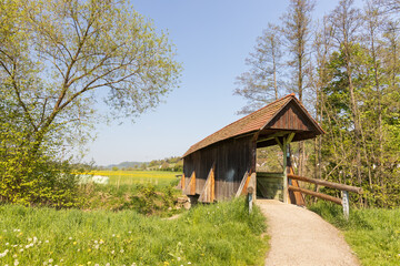 Obraz premium Primitive wooden covered footbridge in the German countryside