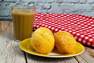 Traditional Brazilian breakfast, cheese bread, and coffee with milk. In portuguese called 