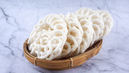 Kerupuk ikan putih is Indonesian traditional deep fried crackers made from starch mixed with...