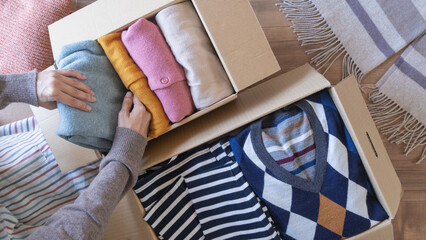 段ボールに服を収納｜衣替え・断捨離・リサイクル　イメージ