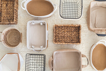 Flat lay of storage boxes; containers and baskets with different sizes and shapes