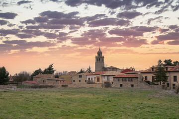 Spectacular sunset in the Medieval village of Medinaceli, photo taken outside the village. Sunset with clouds and orange sky. Date 22-6-22