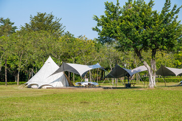 Fototapeta na wymiar Camping tents on the park lawn