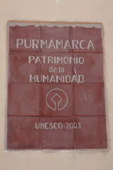 Sign stating that Purmamarca village in Argentina is a world heritage.