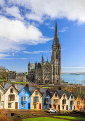 Naklejka premium Church and colorful row houses in Cobh, Ireland