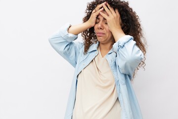 Pregnant woman tired, headache tears and frustration, difficult pregnancy, the last month before childbirth on a white isolated background in a T-shirt with a blue shirt