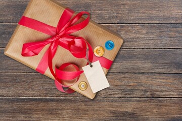 Beautiful gift box with ribbon on desk