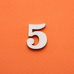 Number five - white number in wood on pink background