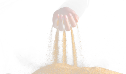 Hand releasing dropping sand. Fine Sand flowing pouring through fingers against black background. Summer beach holiday vacation and time passing concept. Isolated high speed shutter