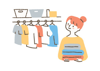 衣類の整理をしている女性_色 © きなこもち