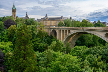 A view of the city of Luxembourg with the Adolphe Bridge. The towering building is the State Bank...