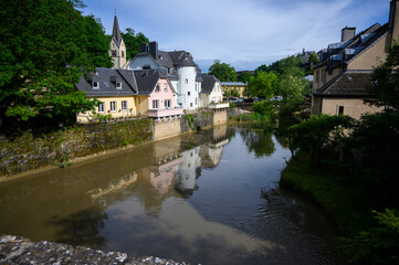 Fototapeta na wymiar The Alzette River in the Pfaffenthal District of the Luxembourg City. Luxembourg, 2021/07/04.