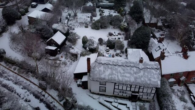 Flying over a Wiltshire village in winter after heavy snow