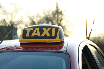 Roof light with word TAXI on car outdoors