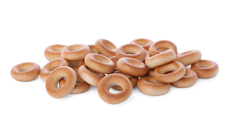 Pile of tasty dry bagels (sushki) on white background