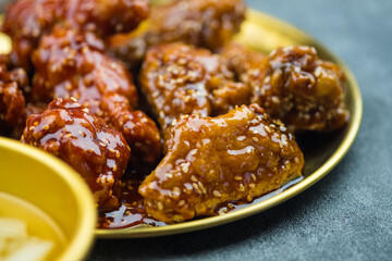 Tasty homemade Korean style deep fried chicken on golden dish