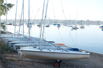 Lake Bde Maka Ska (was Lake Calhoun) quiet and calm with sailboats moored on the shoreline and anchored in the water. Minneapolis Minnesota MN USA