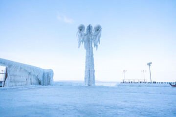 Frozen city after freezing rain. Vladivostok. The street lamp is frozen. Winter city. city in ice