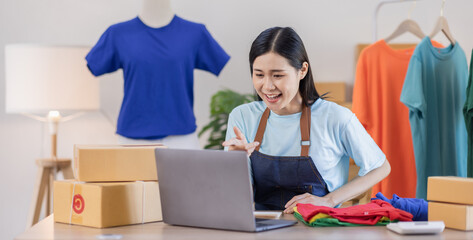 Portrait of young attractive Asian female owner startup business work happy with box at home prepare parcel delivery in sme supply chain, procurement, omnichannel commerce SME online concept.