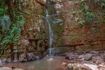 Hidden Small Waterfall Flowing Through Flat Vertical Cliff Taken In Gilan, Iran