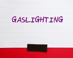 Note paper stick on wall with handwriting GASLIGHTING, refer to person who presents false narrative...