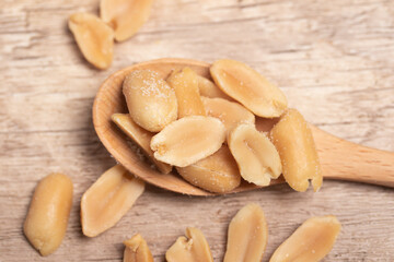 salted roasted peanuts on wooden background