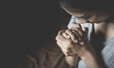 Fototapeta premium Woman praying in the morning. Christianity concept. Pray background. Faith hope love concept.