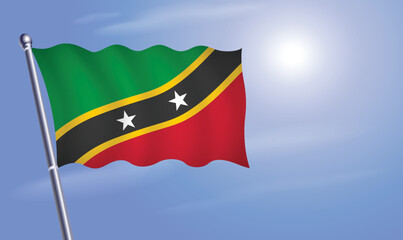 Fototapeta na wymiar ST. Kitts Nevis flag against a blue sky