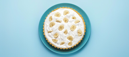 Plate with tasty banana cake on blue background