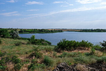 Beautiful landscape with green shore and calm river