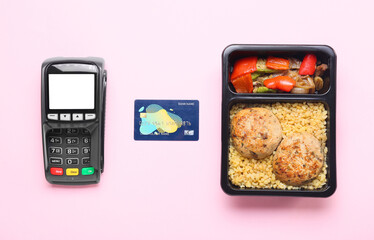 Payment terminal, credit card and box with delicious food on color background