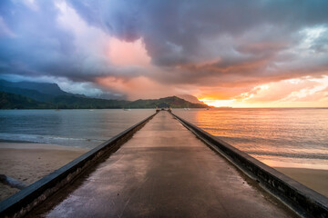 Hawaiian Sunset over the ocean on a pier
