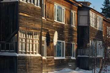 A TV antenna on an old wooden house. Western Siberia. Russia