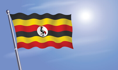 Uganda flag against a blue sky