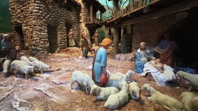 Christmas contemporary representation of religious scene with modern nativity painted figurines. Zoom in