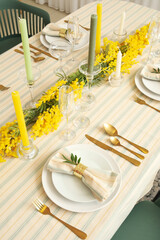 Festive table setting with beautiful floral decor and candles