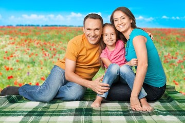 Parents with happy childs on picnic