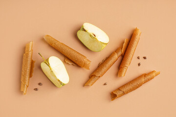 Delicious apple pastilles on color background