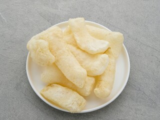 Rambak, or kerupuk kulit is Indonesian traditional crackers. Made from soft inner skin of cattle (Cow or Water Buffalo). 
