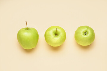 Juicy green apples on color background