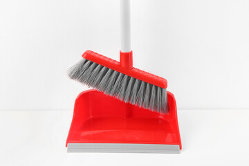 Dustpan with broom isolated on white background, closeup