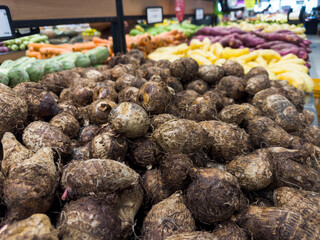 Fresh yams in the supermarket. Vegetables and fruits exposed for consumer choice. Brazilian hortifrutti